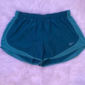 green nike shorts